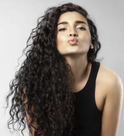 model with deep wave curls